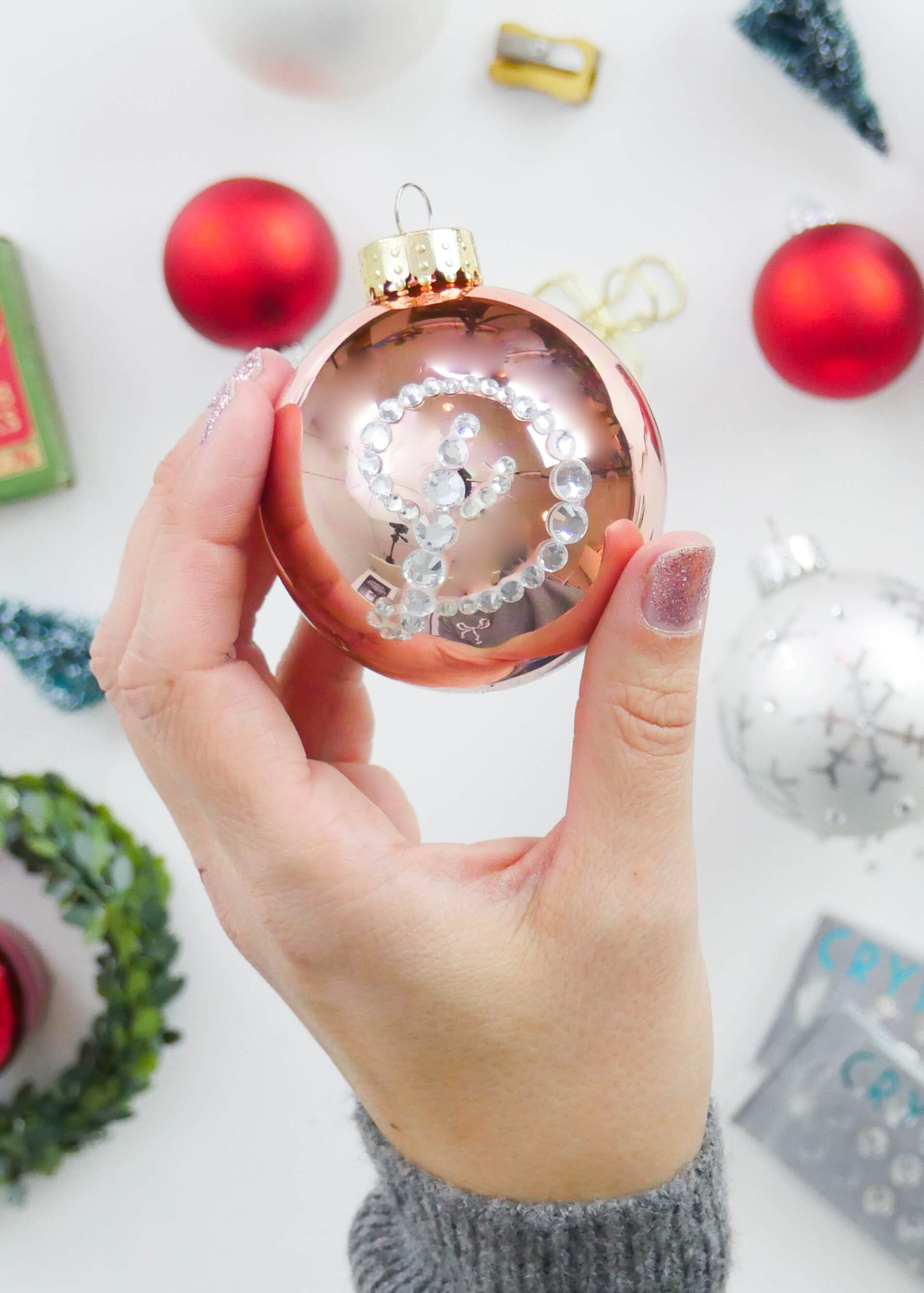 Learn how to create and bejewel your own, personalized, hand lettered Christmas ornaments with this free video tutorial and fully linked supply list from Amanda Arneill of amandaarneill.com